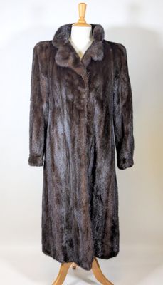 an image of a fur coat on a mannequin stand