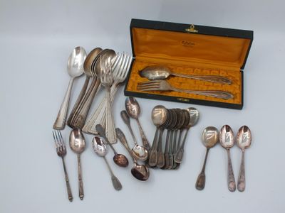 a lot of silver spoons and spoons in a box