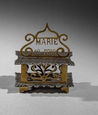 a small metal box with a sign on it