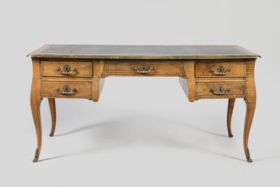an antique desk with marble top and two drawers