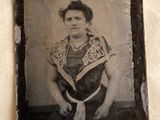 an old photo of a woman in a black and white photo