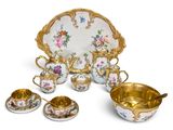 an image of a group of porcelain dishes and cups on a white surface
