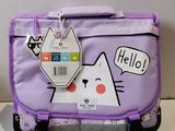 a purple suitcase with a cat sticker on it