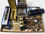 a wooden box filled with assorted items on a white surface