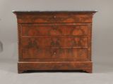 an antique chest of drawers with marble top
