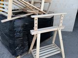 a pile of chairs and a chair on the ground