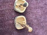 two pairs of shoes that are sitting on a purple surface