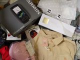 a pile of clothing and a cell phone on the floor