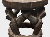 an image of a wooden stool with a circular design on it