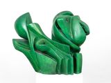 sculpture of a frog made of green marbles on a white pedestal