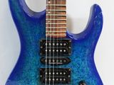a close up of a blue electric guitar on a white background