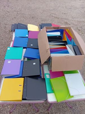 a lot of folders that are sitting on a table