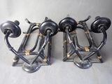 three metal objects that are on display on a table