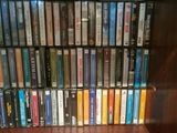 a lot of dvds on a shelf in a room
