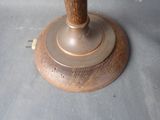 a close up of a wooden candle holder on a table