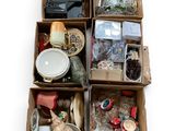 several boxes of assorted items are stacked on top of each other