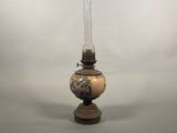 a lamp that is sitting on a table in front of a wall