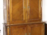 a large wooden cabinet in the corner of a room