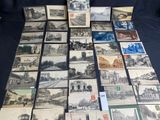 a lot of old postcards that are on the table