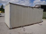 an image of a small storage container in a parking lot