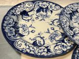 two plates with blue and white designs on them