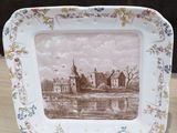 a plate with a picture of a castle on it