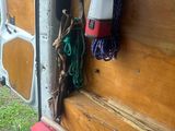 an image of a camper van with a bunch of items in the back