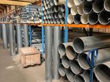 a large amount of pipes in a large warehouse