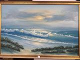 un tableau représentant une scène de plage avec des vagues qui déferlent