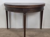 an image of a wooden table with a marble top on a hard wood floor