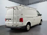 a white van with a ladder on the back of it