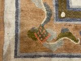 a rug on the floor with a cat laying on it
