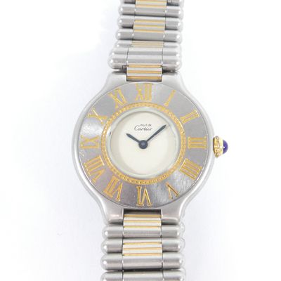 an image of a close up of a wrist watch on a white surface