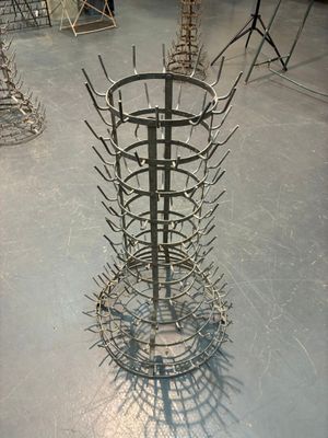 a large metal rack with a bunch of forks inside of it