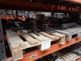 many wooden pallets stacked on a shelf in a warehouse