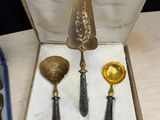 two spoons and a ladle in a box