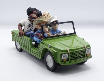 a green toy truck with people in it and a dog in the back