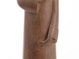 wooden statue of a man with a hat and coat on a white background