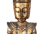 wooden statue of a person with a hat on top of his head