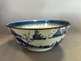 a blue and white bowl sitting on a table