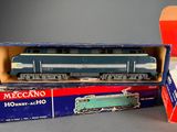 two boxed boxed toy trains sitting on top of a table