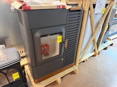 an image of a small stove in a warehouse