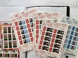 a lot of stamps that are sitting on top of a table