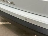 a close up of the rear end of a white car