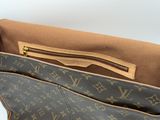 the inside of a louis vuitton bag with the zipper open