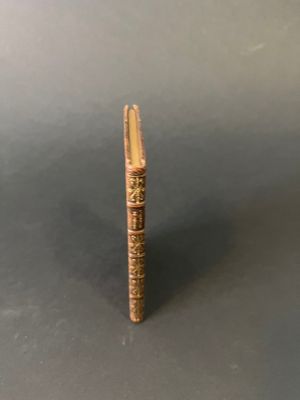 a close up of a wooden stick with writing on it