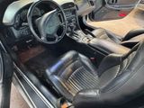 a picture of the interior of a car with black leather seats