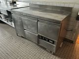 a large stainless steel counter in a commercial kitchen