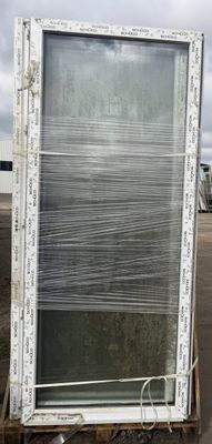 a large window sitting on a cart in a parking lot