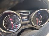 a close up of a car dashboard with gauges and speedometers
